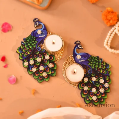 Handcrafted peacock wooden tealight holder with colorful feathers, rhinestone embellishments, and a lit candle