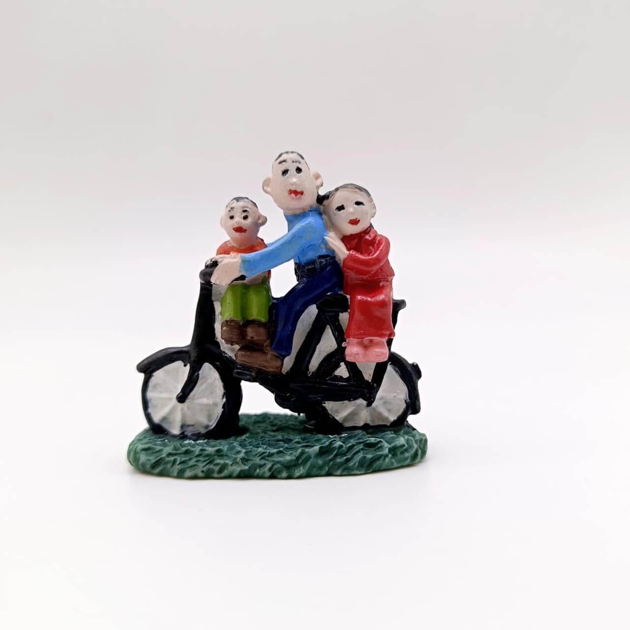 Family Sitting on Cycle Miniature