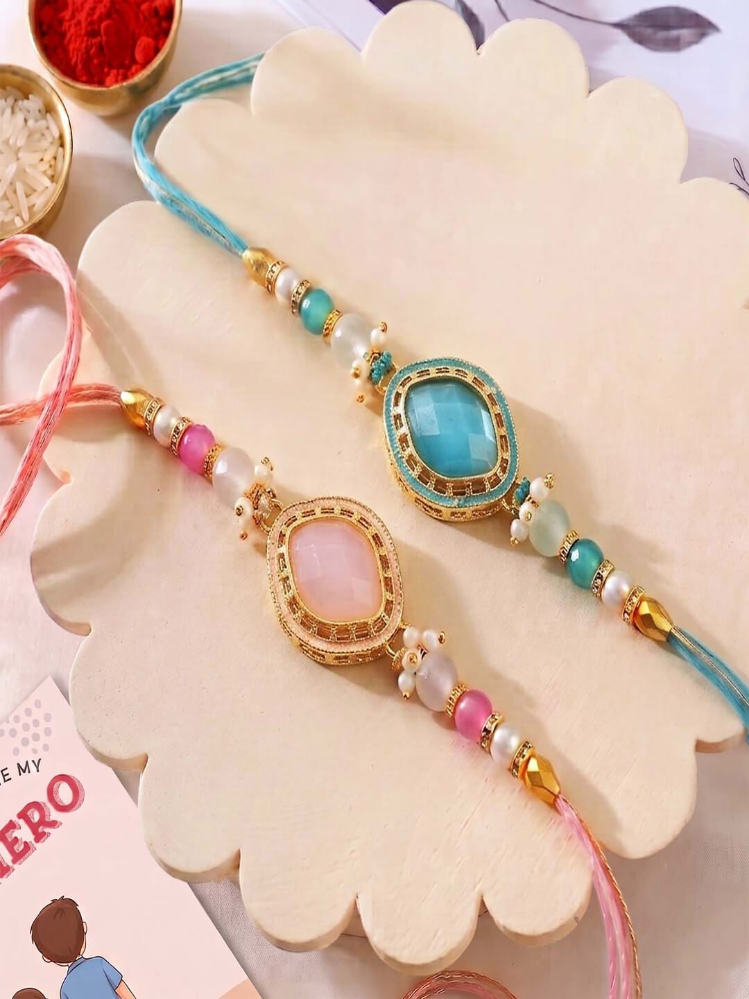ascension Set of 2 with Pastel Pink & Blue Stone, Pearl Beads Rakhi Set for Brother, Bhai Bhaiya & Sister Bracelet with Roli Tilak & You are My Hero Fridge Magnet for Raksha Bandhan Gift