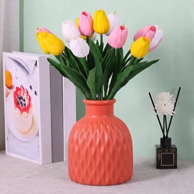Red Plastic Unbreakable Flower Pot with wavy textured pattern placed on a white tabletop.