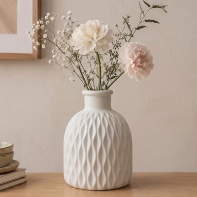 Textured White Plastic Unbreakable Flower Pot on a light wooden table.