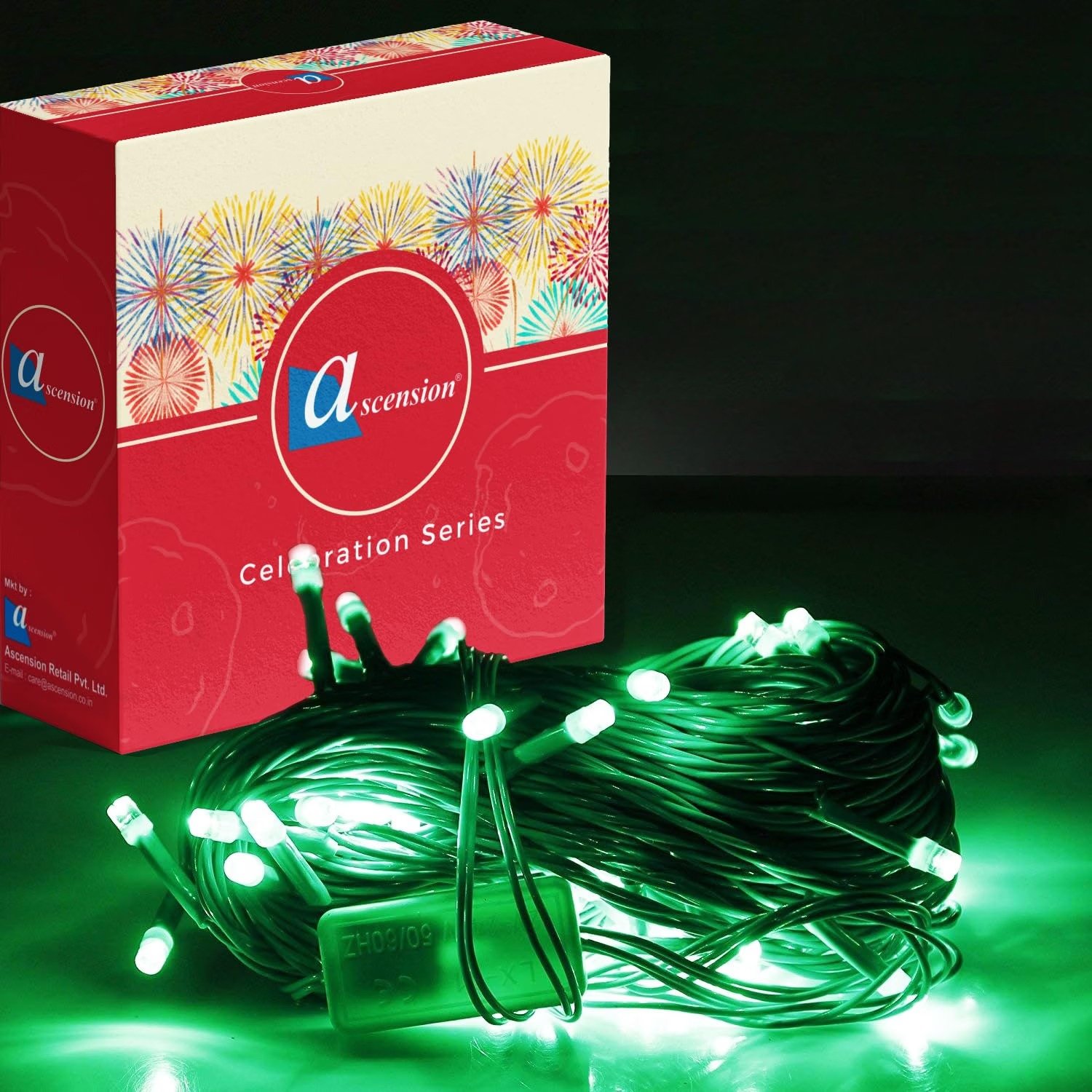 Green fairy string lights bundled next to decorative packaging