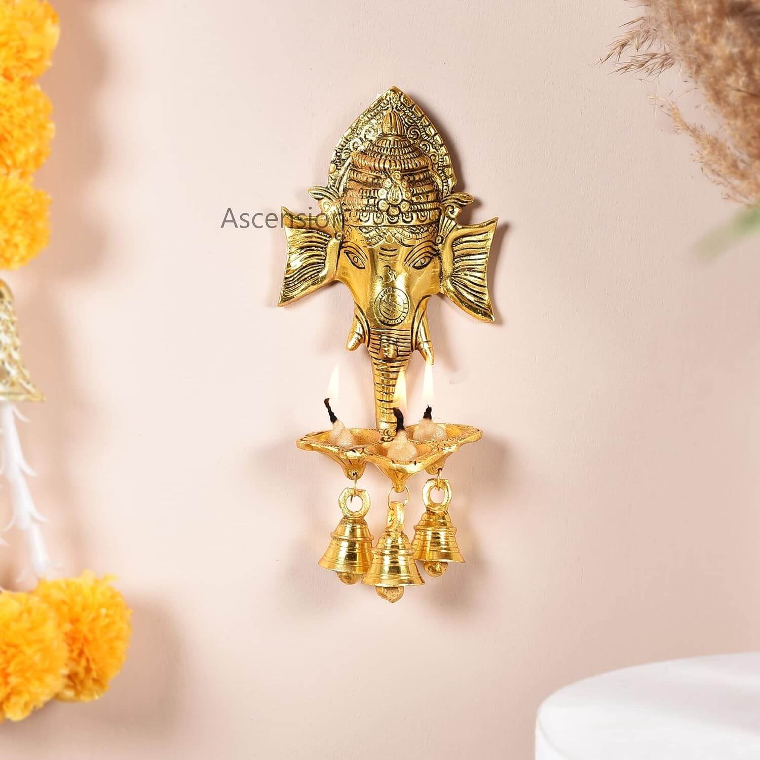 Ascension Ganesh Ji Wall Hanging with Three Diya's and Bells Lord Shree Ganesha Face Sculpture for Home Decor Pooja Room, Diwali Gift Religious Item Decorative Showpiece Metal Hanging Diyas Oil Lamp