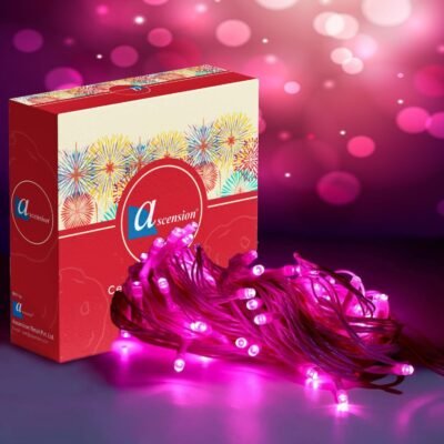 Pink fairy string lights bundled next to decorative packaging