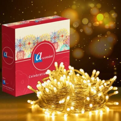 Warm white fairy string lights bundled next to decorative packaging