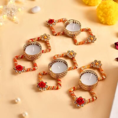 Decorative diya holder set with red orange golden thread and floral embellishments