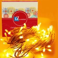 Yellow fairy string lights bundled next to decorative packaging