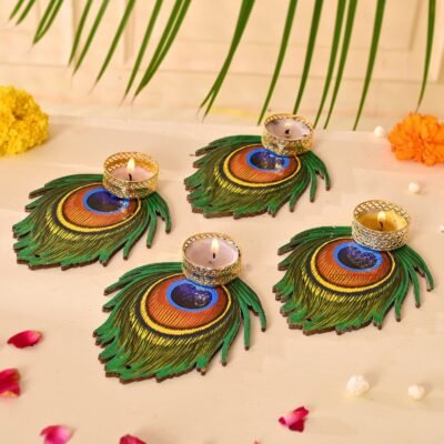 Hand-painted wooden peacock feather tealight candle holders with gold metal cups and lit candles