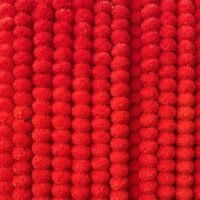 Densely packed 5 Pcs Red Handmade Artificial Marigold Flowers arranged vertically to form a vibrant wall backdrop.