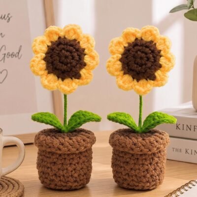 Pack of 2 Handmade Crochet Sunflower in Pot placed side by side on a wooden table.