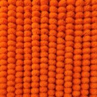 Densely packed 5 Orange Pcs Handmade Artificial Marigold Flowers arranged vertically to form a bright wall backdrop.
