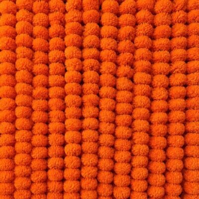 Densely packed 5 Orange Pcs Handmade Artificial Marigold Flowers arranged vertically to form a bright wall backdrop.
