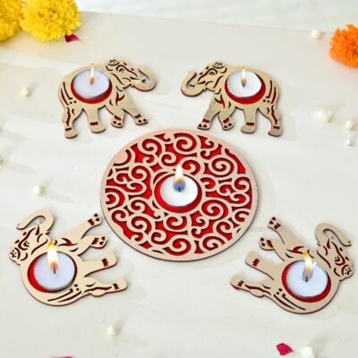 Wooden laser cut elephant tealight candle holders with central mandala disc and lit candles