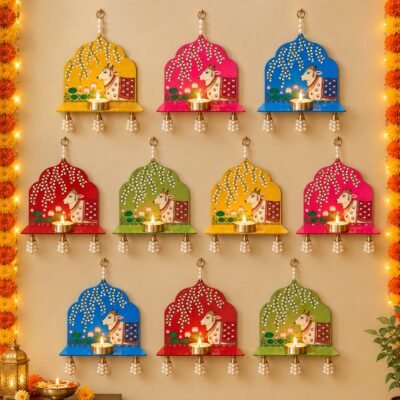 Colorful cow wall hanging diya holders with pearl tassels and diyas for Diwali and pooja decoration