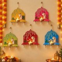 Colorful cow wall hanging diya holders with pearl tassels and diyas for Diwali and pooja decoration