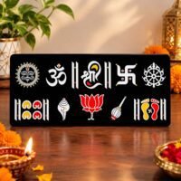 Black decorative Hindu religious symbols wall plaque with Om, Shree, Swastik, lotus, conch shell and sacred footprints