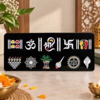 Black decorative Hindu religious symbols wall plaque with Om, Shree, Swastik, lotus, conch shell and sacred footprints