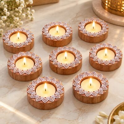 Handcrafted Wooden Tealight holder set with lit candles and white mandala pattern on marble.