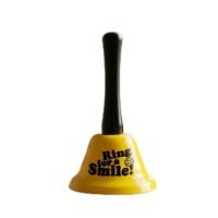 Bright yellow novelty hand bell with black handle printed with Ring for a Smile text and smiley face graphic