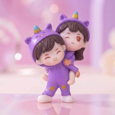 Ascension unicorn couple showpiece featuring two figures in purple unicorn onesies sharing a piggyback ride.