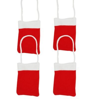 Four mini red Christmas treat bags with white cuffs and string handles hanging against a white background.