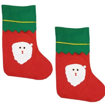 Two red felt Santa face Christmas stockings with green zig-zag cuffs isolated on a white background.