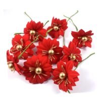 A cluster of red artificial Christmas flowers featuring gold bead centers and thin green wire stems on a white background.