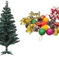 Ascension artificial Christmas tree set with a large collection of ornaments including Santas, bells, and baubles.