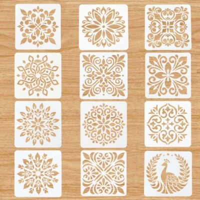 Floral Tile Stencil Set of 12 square 4-inch templates displaying detailed mandala, tile, and peacock designs on a light wood surface.