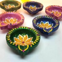 Ascension handpainted clay diya set pack of 6 featuring multicolor terracotta oil lamps with center flower design.