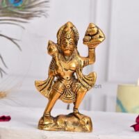 Brass Hanuman statue carrying Sanjeevani mountain and gada mace on a white table