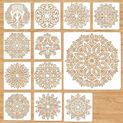 Large Mandala Stencil Set of 12 square 12-inch templates displaying detailed mandala and twin peacock designs on a light wood background.