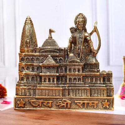 Golden brass Ayodhya Ram Mandir statue featuring Lord Ram with bow and Jai Shree Ram inscription on wooden surface