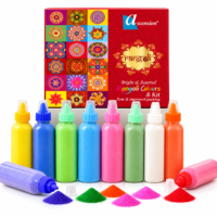 Ascension rangoli colors kit featuring a red box and ten squeeze bottles filled with assorted colorful powders alongside small powder piles.